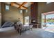 Pool house interior with fireplace and seating, creating a comfortable space by the pool at 15550 W 64Th Pl # D, Arvada, CO 80007