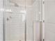 Shower featuring white subway tile, a built in seat and multiple shower heads at 15550 W 64Th Pl # D, Arvada, CO 80007