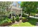 Charming backyard patio features a pergola, dining table, and mature landscaping at 4545 S Monaco St # 114, Denver, CO 80237