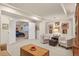 Finished basement with living area, an open bedroom, and carpeted floors at 4545 S Monaco St # 114, Denver, CO 80237