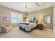 Cozy bedroom shows neutral walls, comfortable furniture, and bright, shuttered window at 4545 S Monaco St # 114, Denver, CO 80237