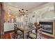 This dining area is open to the kitchen and offers a fireplace at 4545 S Monaco St # 114, Denver, CO 80237
