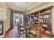 Well appointed dining area boasts a large bookcase, table, and outdoor access at 4545 S Monaco St # 114, Denver, CO 80237