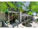 Inviting exterior of Le French restaurant with a charming patio seating area, and flower decorations at 4545 S Monaco St # 114, Denver, CO 80237