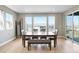 Dining area featuring natural light, hardwood floors, a dining table, and a large sliding glass door at 6955 Sunstrand Ct, Castle Pines, CO 80108