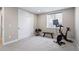 The exercise room features ample space, a large closet, and carpeted floors at 6955 Sunstrand Ct, Castle Pines, CO 80108