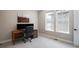 Bright office space featuring a modern desk setup and large windows for natural light at 6955 Sunstrand Ct, Castle Pines, CO 80108