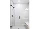 Beautiful walk-in shower features stylish tile work and modern fixtures at 6955 Sunstrand Ct, Castle Pines, CO 80108