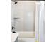 Updated bathroom featuring a shower with gray tile and a modern shower head at 6955 Sunstrand Ct, Castle Pines, CO 80108