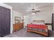 Well-lit main bedroom showcasing a bed, dresser, and plenty of space, offering a comfortable retreat at 8400 Adams Way, Denver, CO 80229
