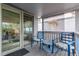 Inviting porch with comfortable seating and a sliding glass door leading indoors at 8400 Adams Way, Denver, CO 80229