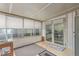 Inviting sunroom featuring large windows and a glass door, perfect for enjoying natural light and outdoor access at 8400 Adams Way, Denver, CO 80229
