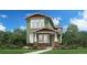 Charming two-story home featuring a covered porch, brick accents, and a beautifully landscaped front yard at 950 Promenade Dr, Superior, CO 80027