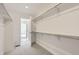 Walk-in closet featuring shelving units and carpet floors at 4846 Astor Pl, Brighton, CO 80601