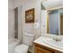 Modern bathroom with a tub-shower combo, white vanity, and stylish mirror at 11760 Baca Rd, Conifer, CO 80433