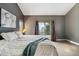 Primary suite featuring soft decor, outside deck access and beautiful natural light at 11760 Baca Rd, Conifer, CO 80433