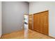 Bright bedroom featuring hardwood floors, a spacious closet and neutral paint at 11760 Baca Rd, Conifer, CO 80433