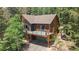 Beautiful exterior with a charming deck, providing picturesque views at 11760 Baca Rd, Conifer, CO 80433