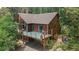 Beautiful exterior featuring a charming deck and providing picturesque views at 11760 Baca Rd, Conifer, CO 80433