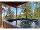 Relaxing hot tub with picturesque views of the surrounding mountain landscape at 11760 Baca Rd, Conifer, CO 80433