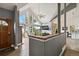 Open living room offers a vaulted ceiling, lots of natural light, and beautiful wood floors at 11760 Baca Rd, Conifer, CO 80433