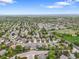 Picturesque neighborhood with mature trees, manicured lawns, and various community amenities from above at 5554 S Ward Way, Littleton, CO 80127