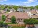 Charming home with a fenced backyard and a deck, set against a backdrop of scenic mountains at 5554 S Ward Way, Littleton, CO 80127