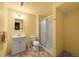 Bathroom with vanity sink, toilet, and shower in neutral tones, designed for functionality at 5554 S Ward Way, Littleton, CO 80127
