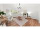 Serene bedroom featuring a stylish chandelier, work space, and bright shuttered windows at 5554 S Ward Way, Littleton, CO 80127