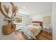 Cozy bedroom with hardwood floors, bright natural light, and stylish modern decor at 5554 S Ward Way, Littleton, CO 80127