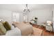 Spacious bedroom with hardwood floors, closet, and bright natural light from windows at 5554 S Ward Way, Littleton, CO 80127