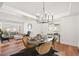 Spacious dining area featuring elegant furnishings and an open layout to the living room at 5554 S Ward Way, Littleton, CO 80127