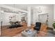 Elegant dining area featuring a modern chandelier and stylish furnishings at 5554 S Ward Way, Littleton, CO 80127