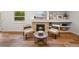 Cozy living room fireplace flanked by seating, with natural light and modern decor accents at 5554 S Ward Way, Littleton, CO 80127