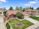 Charming home featuring a well-manicured lawn, a cozy porch, and an attached two-car garage at 5554 S Ward Way, Littleton, CO 80127