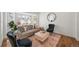 Cozy living room featuring a bay window, comfortable seating, and a stylish rug at 5554 S Ward Way, Littleton, CO 80127