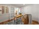 Comfortable office area featuring a light wood desk, a rattan chair, and neutral tones at 5554 S Ward Way, Littleton, CO 80127