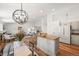 Bright, open-concept layout with kitchen island flowing into the living area at 5554 S Ward Way, Littleton, CO 80127