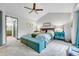 Bedroom featuring vaulted ceiling, lots of light, and stylish decor at 11820 W 66Th Pl # C, Arvada, CO 80004