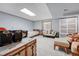 Cozy basement bedroom with ample seating, carpeted floors, and natural light from the window at 11820 W 66Th Pl # C, Arvada, CO 80004