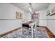 Charming dining room with elegant chandelier, gray furniture, and stylish area rug at 11820 W 66Th Pl # C, Arvada, CO 80004