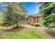 View of the house with wooden sidings, shrubs and lawn at 11820 W 66Th Pl # C, Arvada, CO 80004