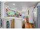 Bright kitchen with eat-in dining area, stainless appliances, and hardwood floors at 11820 W 66Th Pl # C, Arvada, CO 80004