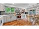 Updated kitchen with granite countertops, stainless steel appliances, and hardwood flooring at 11820 W 66Th Pl # C, Arvada, CO 80004