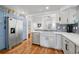 Charming kitchen featuring stainless-steel appliances and open design to the main living space at 11820 W 66Th Pl # C, Arvada, CO 80004
