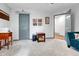 Functional living room features gray carpet and access to other rooms at 11820 W 66Th Pl # C, Arvada, CO 80004