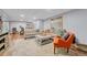 Inviting living room features warm wood floors, large area rug, and comfortable seating arrangement at 11820 W 66Th Pl # C, Arvada, CO 80004