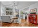 Bright living room featuring stylish furniture, a cozy fireplace, and an open view to the kitchen at 11820 W 66Th Pl # C, Arvada, CO 80004