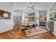 Spacious living room with stylish decor, vaulted ceilings, and an inviting fireplace area at 11820 W 66Th Pl # C, Arvada, CO 80004