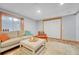 Comfortable living room bathed in natural light features hardwood floors, and a cozy seating area at 11820 W 66Th Pl # C, Arvada, CO 80004